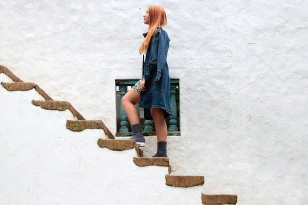 photo of woman climbing stairs